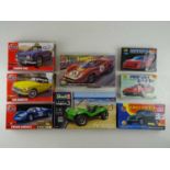 A group of unbuilt 1:32 scale plastic car kits, primarily racing examples by AIRFIX, REVELL &