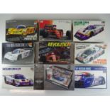 A group of unbuilt 1:24 scale plastic car kits, primarily racing examples by HASEGAWA (contents