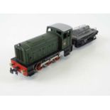 A TRIX TWIN 244 Diesel Shunter set containing locomotive and shunter's truck - G/VG in G box