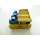 A DINKY 33W Mechanical Horse/Open Wagon trade box complete with 3 examples of the model in blue with