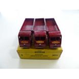 A DINKY 30W Electric Articulated Lorry trade box complete with 3 examples of the model in maroon - G