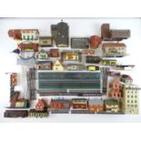 A group of HO/OO gauge plastic kitbuilt houses and buildings together with other accessories - F/G