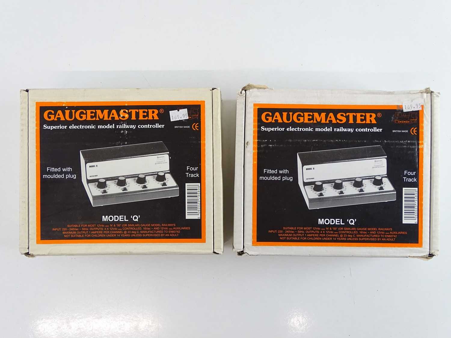 A pair of GAUGEMASTER model Q four track controllers, appear as new, controllers are ex-shop