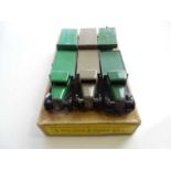 A DINKY 25T Flat Truck & Trailer trade box complete with 3 examples of the model, 2 in green, 1 in