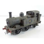 A finescale O gauge kitbuilt class 14xx 0-4-2 steam tank locomotive in BR weathered black livery