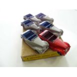 A DINKY 38E Armstrong Siddeley Coupe trade box complete with 6 examples of the model, 4 in grey, 1
