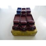 A DINKY 30J Austin Wagon trade box complete with 6 examples of the model, 1 in blue and 5 in