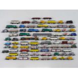 A large quantity of unboxed MARKLIN Z gauge comprising a small steam locomotive, wagons and