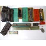 A group of HORNBY SERIES O gauge 3-rail track, accessories and tinplate station, some in original