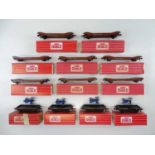 A group of HORNBY DUBLO OO gauge Lowmac wagons and Low-sided wagons with tractor, some in Tony
