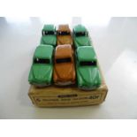 A DINKY 40F Hillman Minx Saloon trade box complete with 6 examples of the model, 2 in brown and 4 in