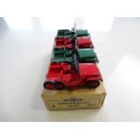 A DINKY 25Y Universal Jeep trade box complete with 4 examples of the model, 2 in green, 2 in red - G