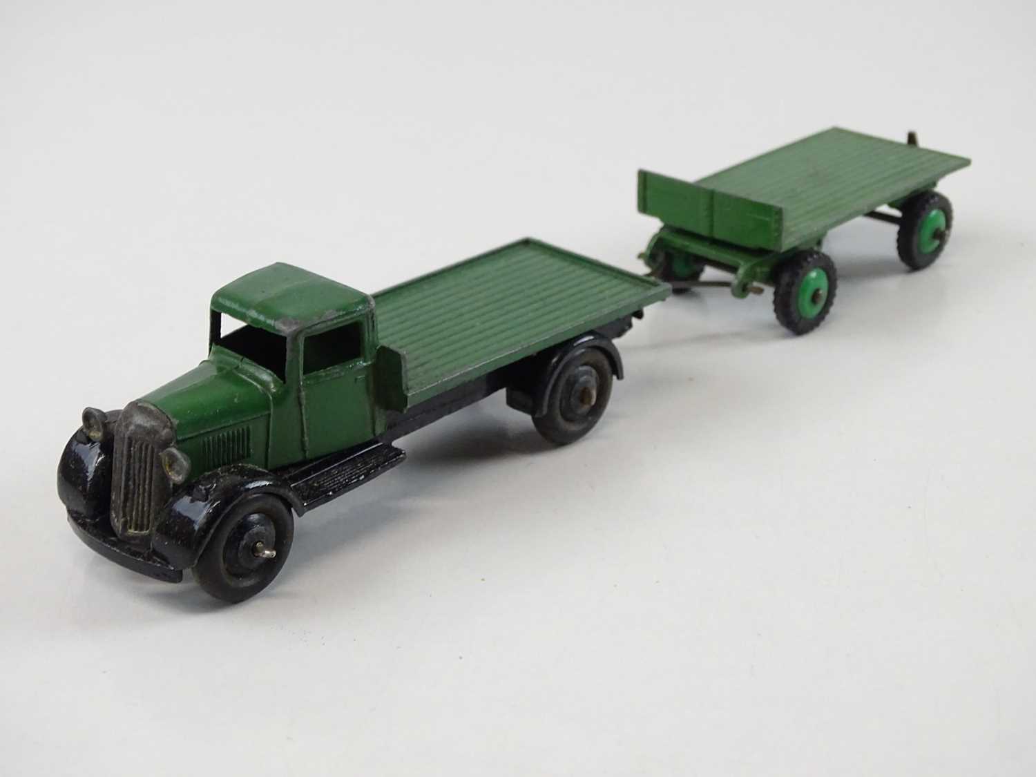 A DINKY 25T Flat Truck & Trailer trade box complete with 3 examples of the model, 2 in green, 1 in - Image 8 of 9