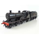 A finescale O gauge kitbuilt class 2P 4-4-0 steam locomotive in BR black mixed traffic livery