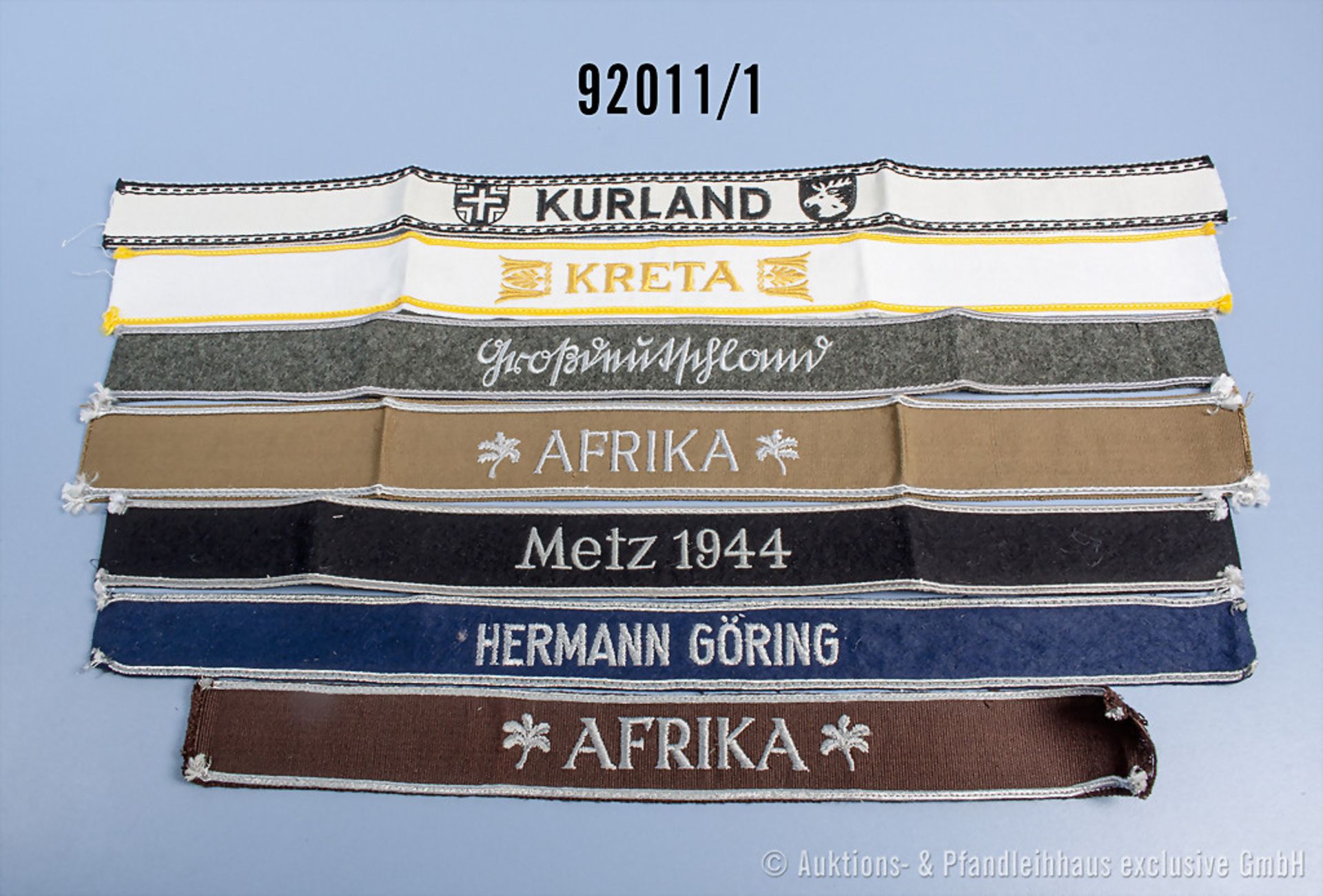 Konvolut 20 Ärmelbänder und Ärmelstreifen, u.a. Metz 1944, Kurland, Kreta, Afrika, ...