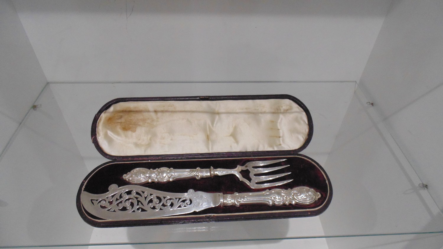Cake knife and fork in leather bound display case