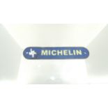 Cast metal michelin sign