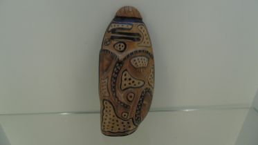 Wooden tribal art piece by Kenny Mason