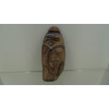 Wooden tribal art piece by Kenny Mason