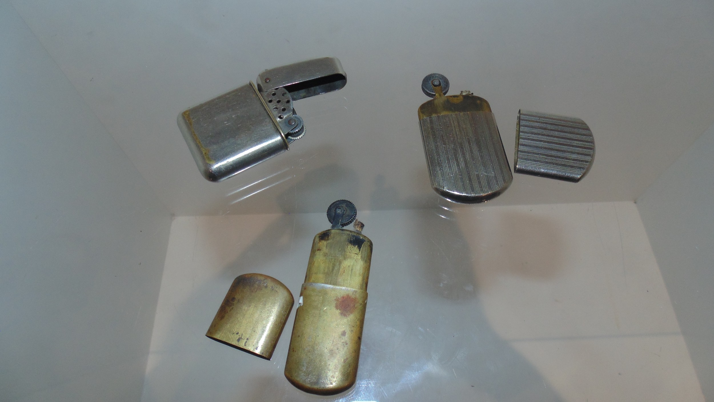 3 x 1920-1930 wind proof lighters .