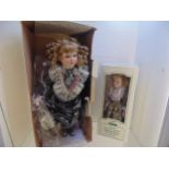 2 boxed porcelain Dolls