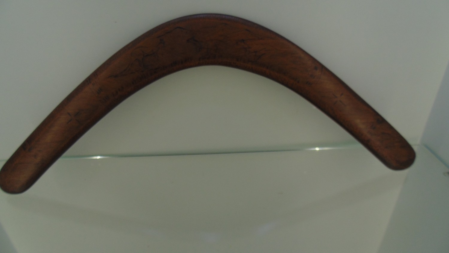 Boomerang engraved with kangaroos