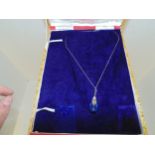 silver chain with blue stone pendant in original box