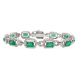 18ct white gold emerald cut emerald and round brilliant cut diamond bracelet