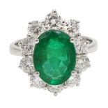 White gold oval emerald and round brilliant cut diamond ring