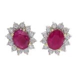 Pair of 9ct gold oval ruby and diamond cluster stud earrings