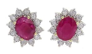 Pair of 9ct gold oval ruby and diamond cluster stud earrings