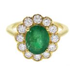 18ct gold oval emerald and diamond cluster ring