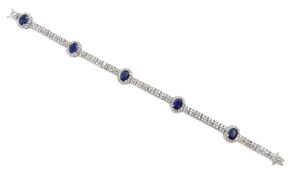 18ct white gold oval sapphire and round brilliant cut diamond link bracelet