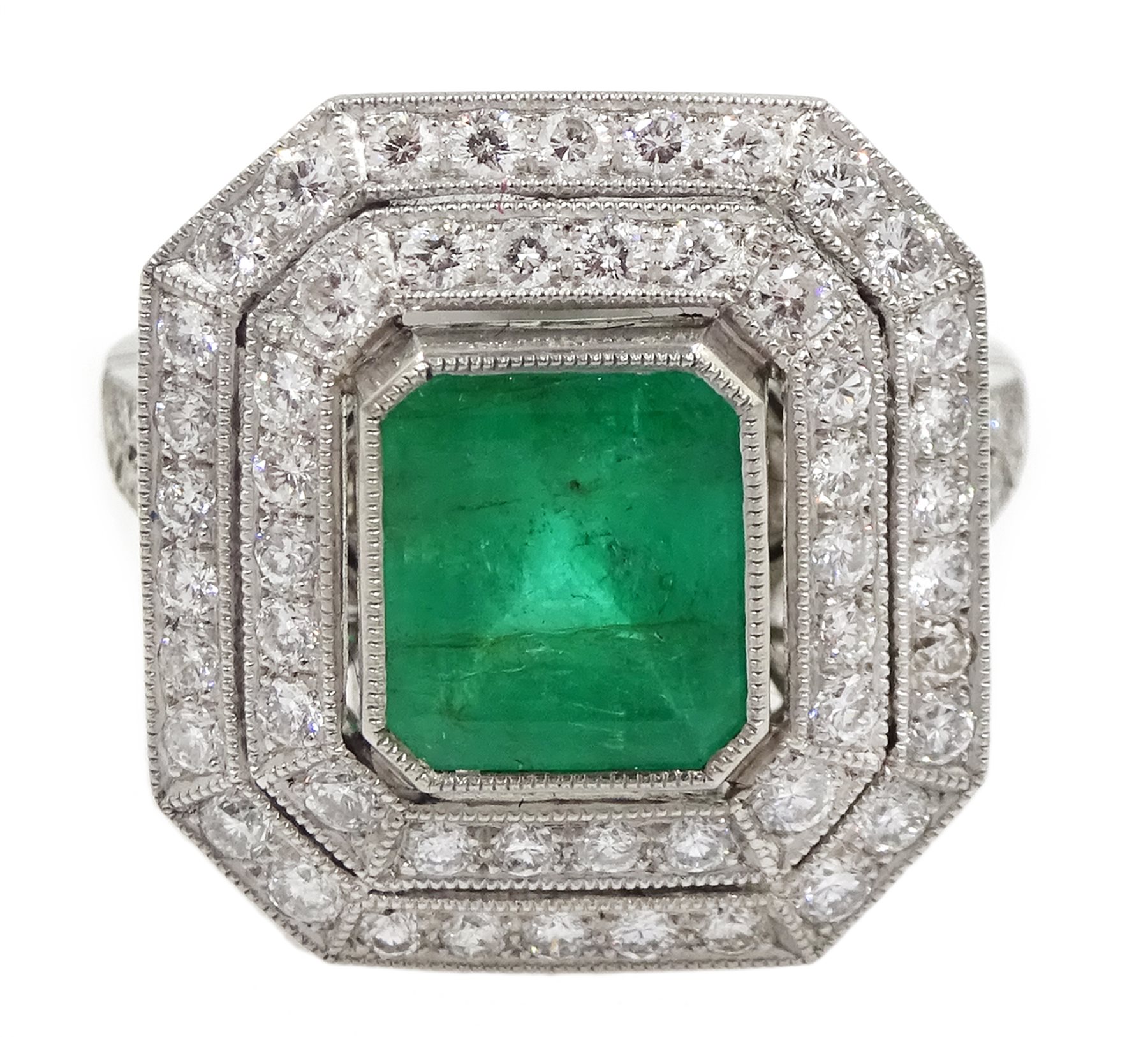 Platinum emerald and double row diamond ring