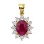 Gold oval ruby and round brilliant cut diamond pendant