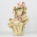 A large ceramic Royal Dux statue of a lady.