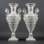 A pair of Porcelaine de Couleuvre vases with hand-painted decor.