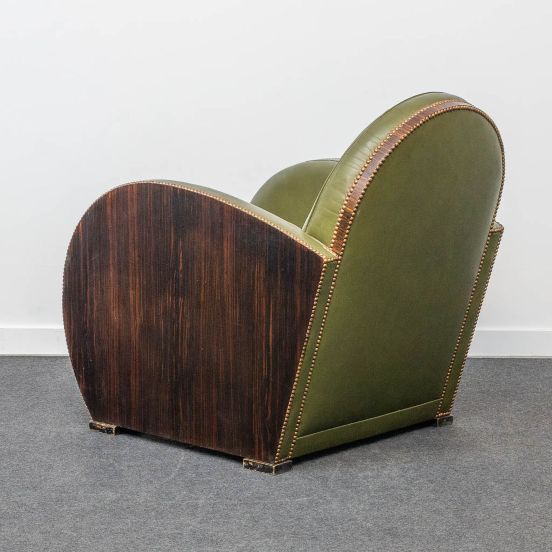 An armchair, upholstered with leather and with wood sides, art deco style. - Image 9 of 20