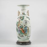 A Chinese vase with wise men, immortals an elephant and pine trees, caligraphic texts.