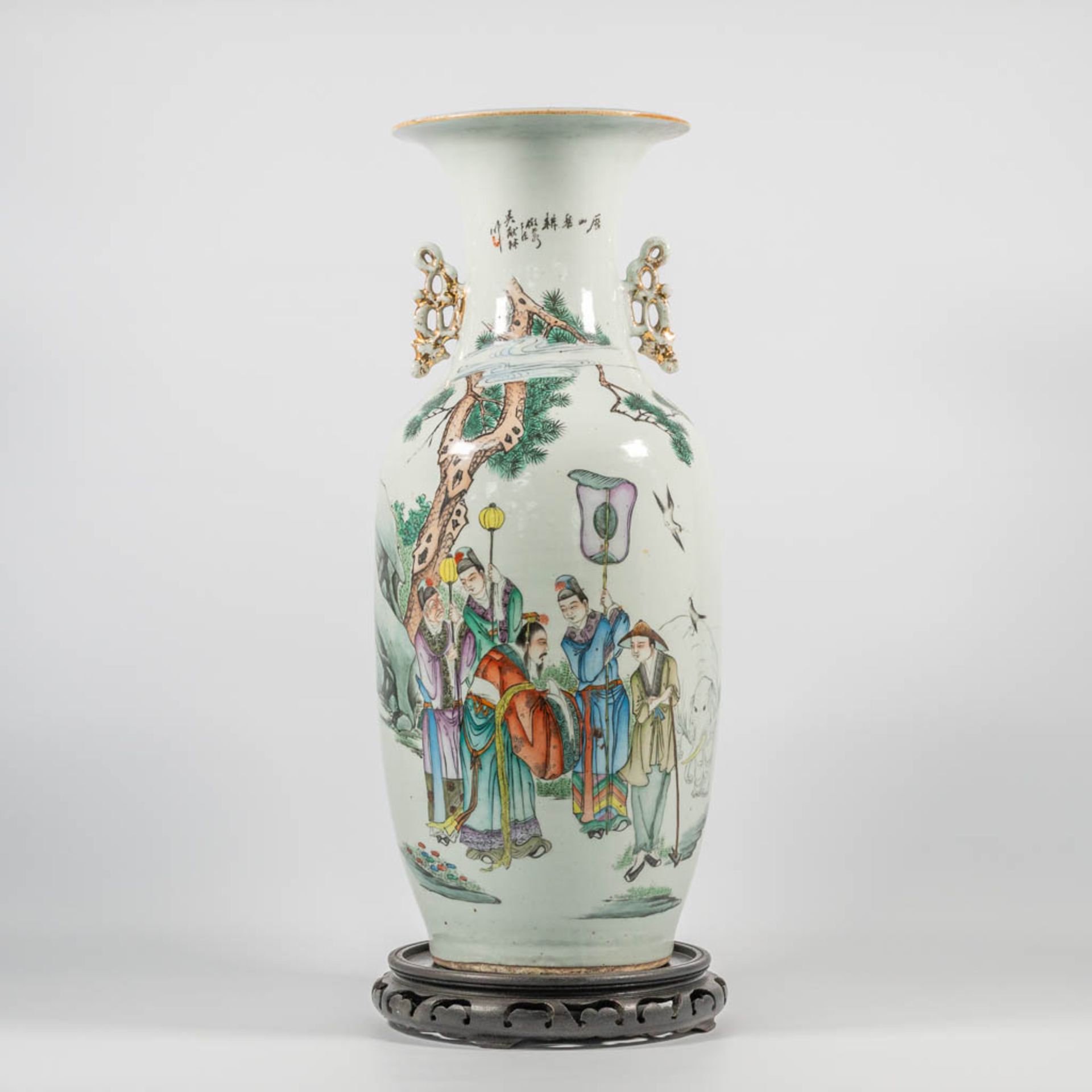 A Chinese vase with wise men, immortals an elephant and pine trees, caligraphic texts.