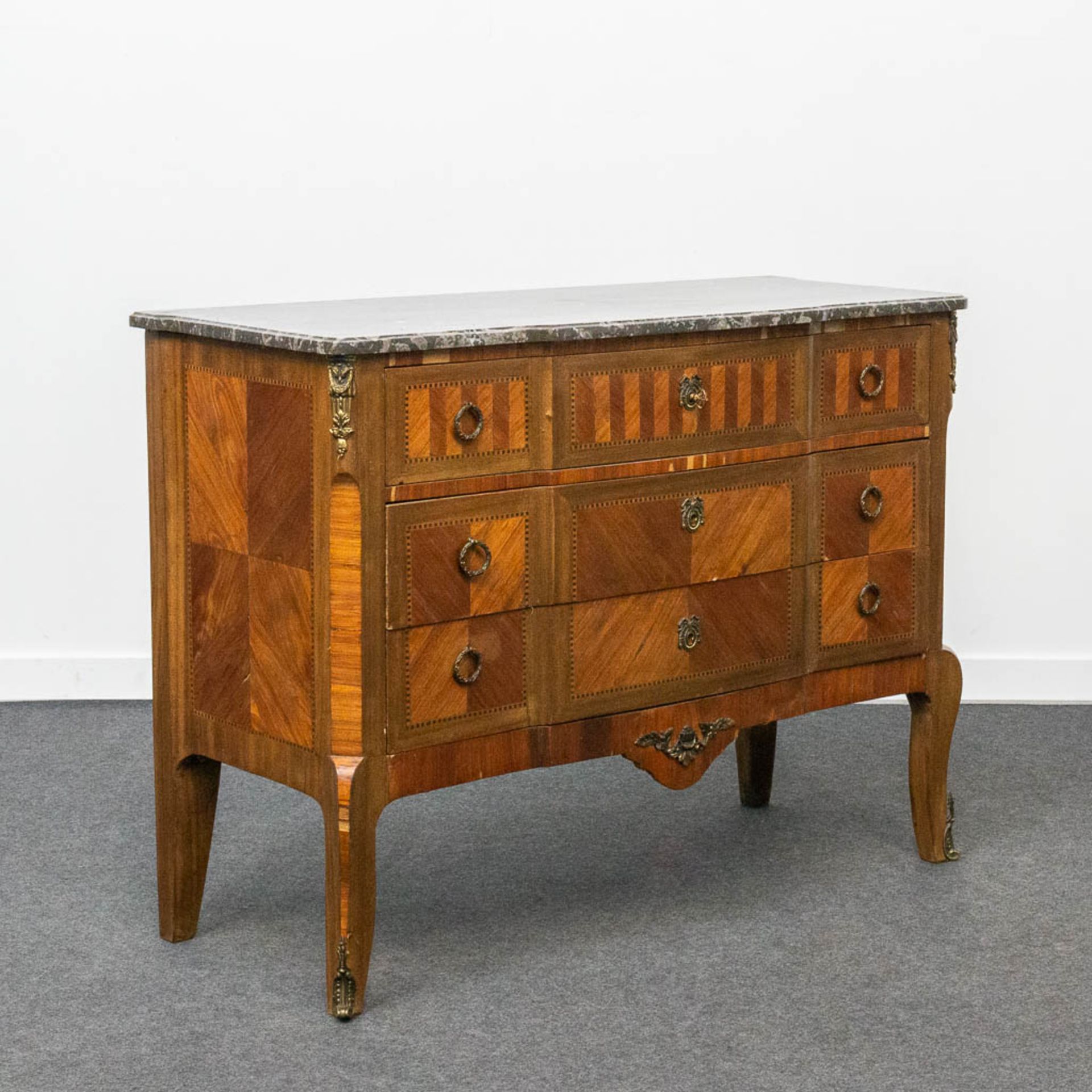 A bronze mounted 3-drawer commode with marble top.