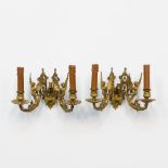 A Pair of wall lamps, with winged figurines, Louis XVI style.