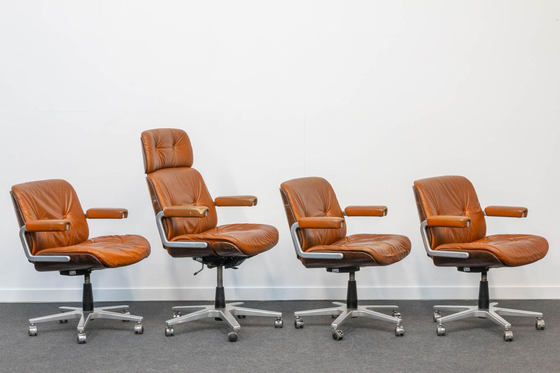 Martin STOLL (XX-XXI) A collection of 4 office chairs on wheels for Giroflex. Finished with leather