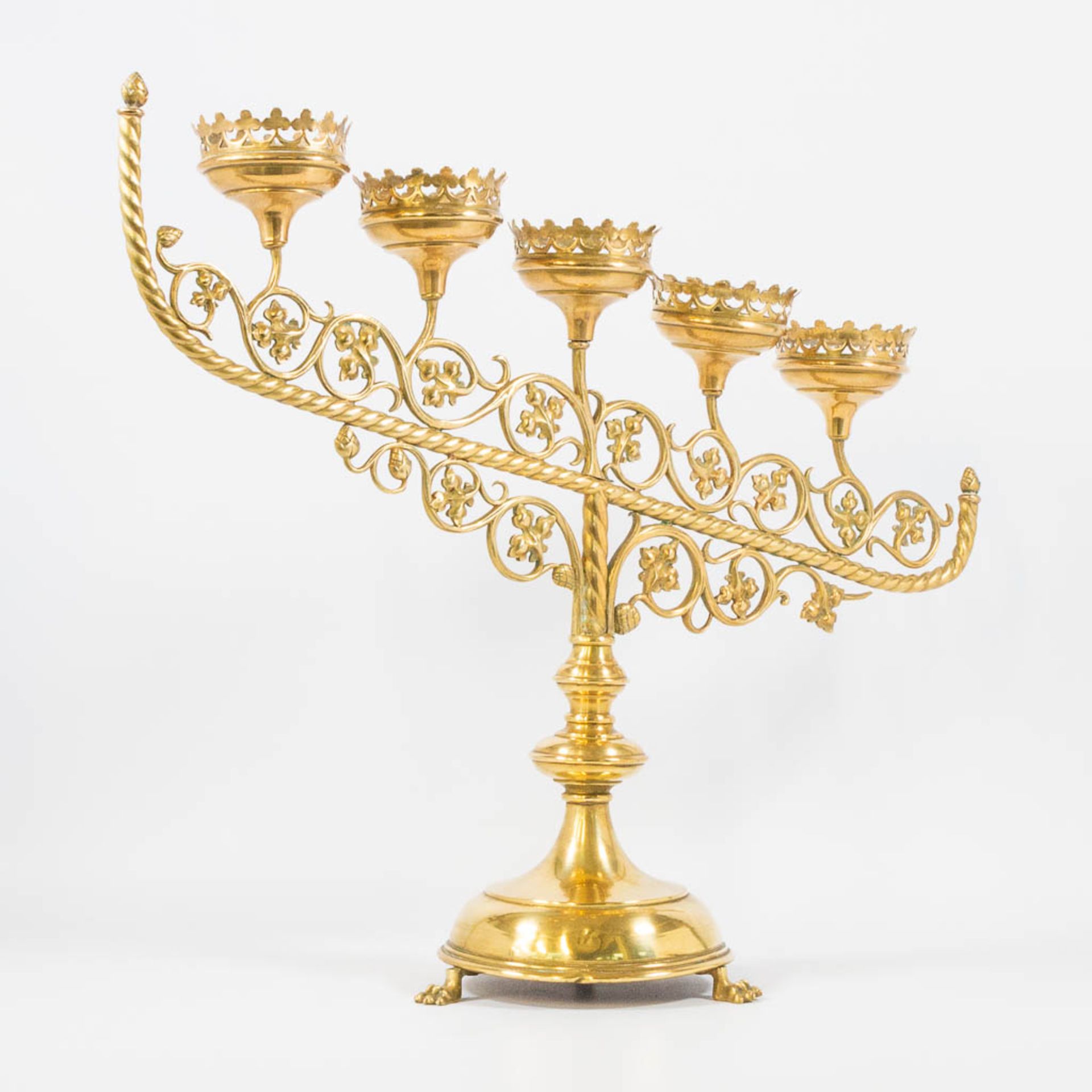 An Antique brass church candelabra, decorated with grape vine leaves and standing on claw feet, Fran - Image 8 of 22