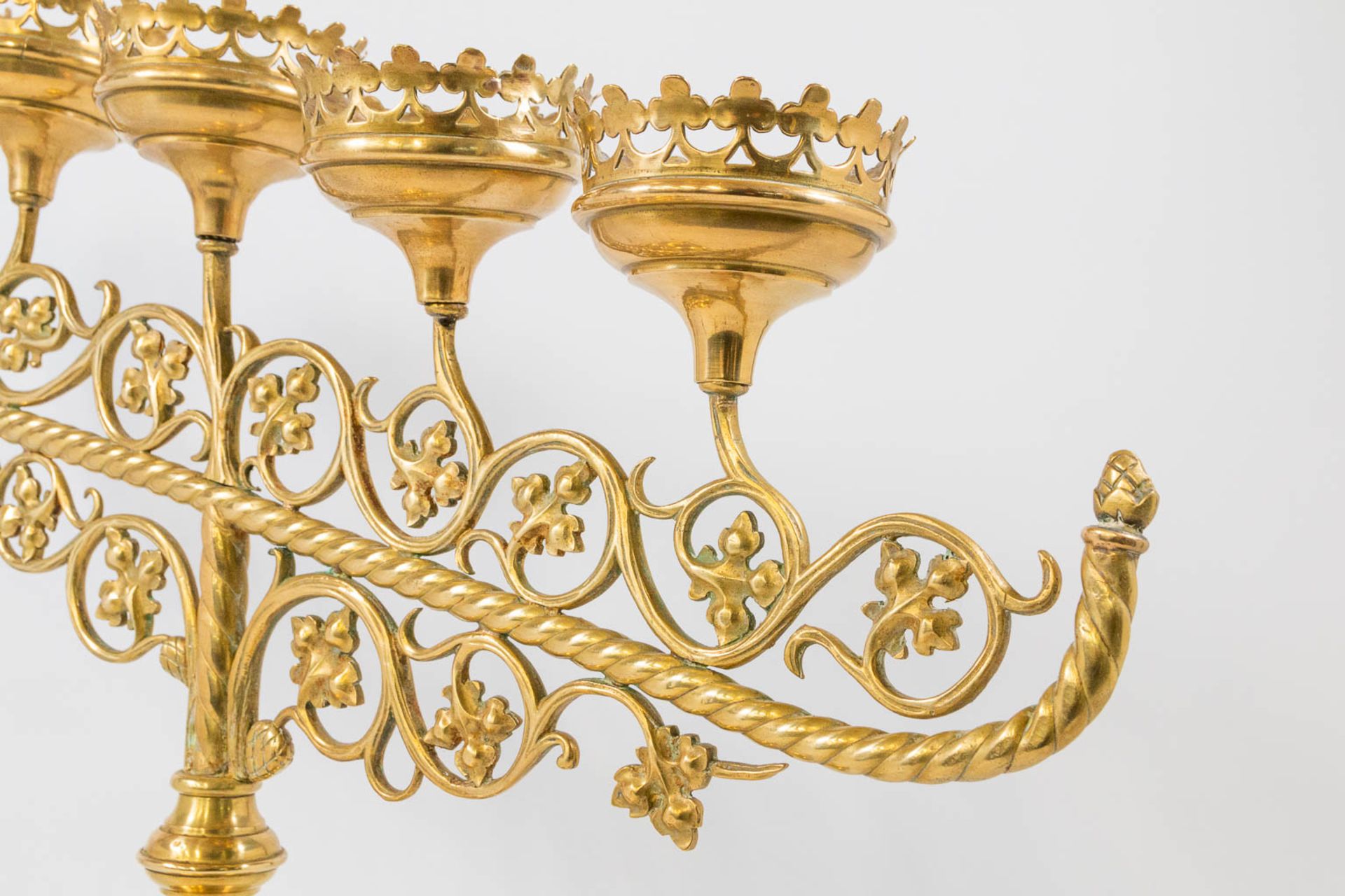 An Antique brass church candelabra, decorated with grape vine leaves and standing on claw feet, Fran - Image 21 of 22