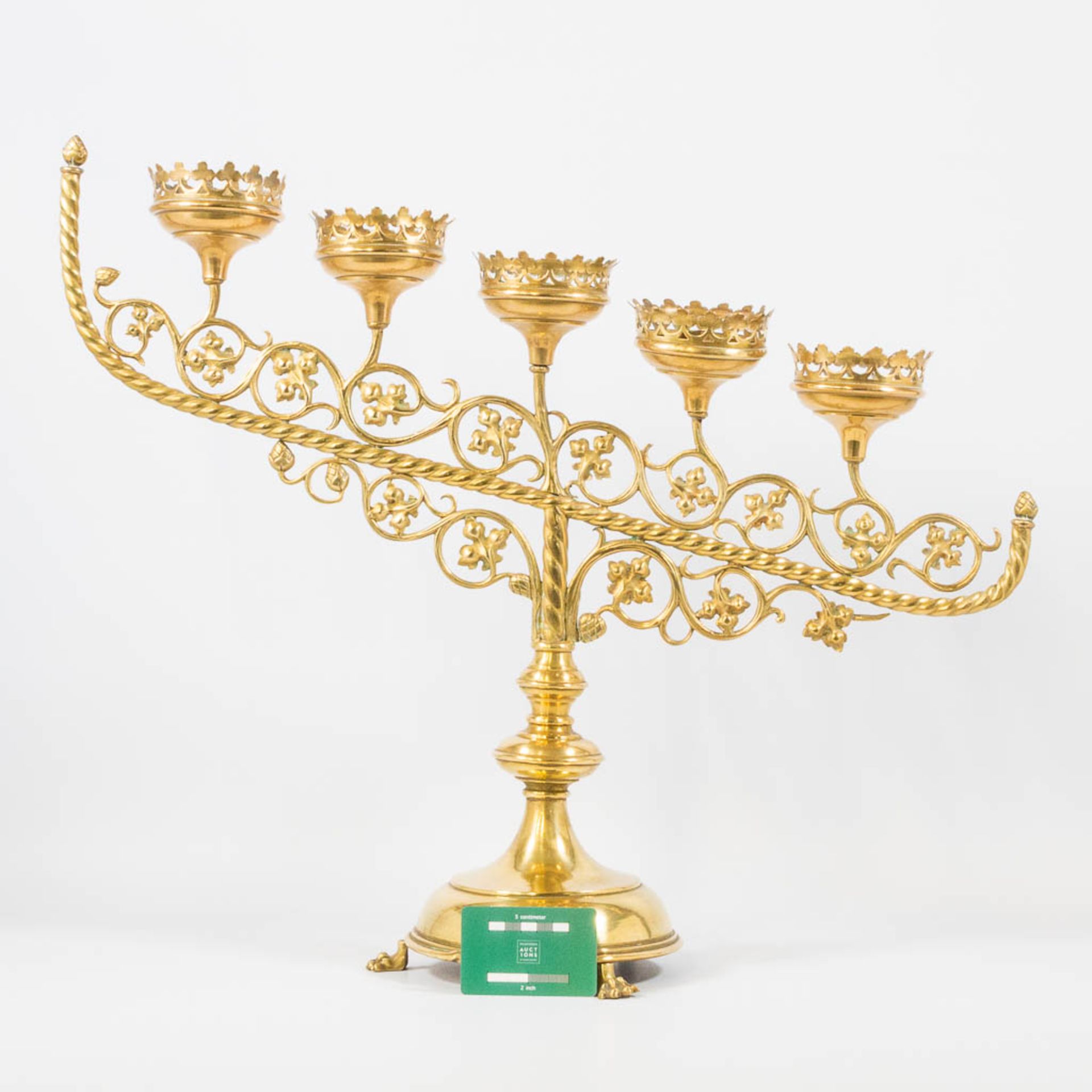 An Antique brass church candelabra, decorated with grape vine leaves and standing on claw feet, Fran - Image 7 of 22