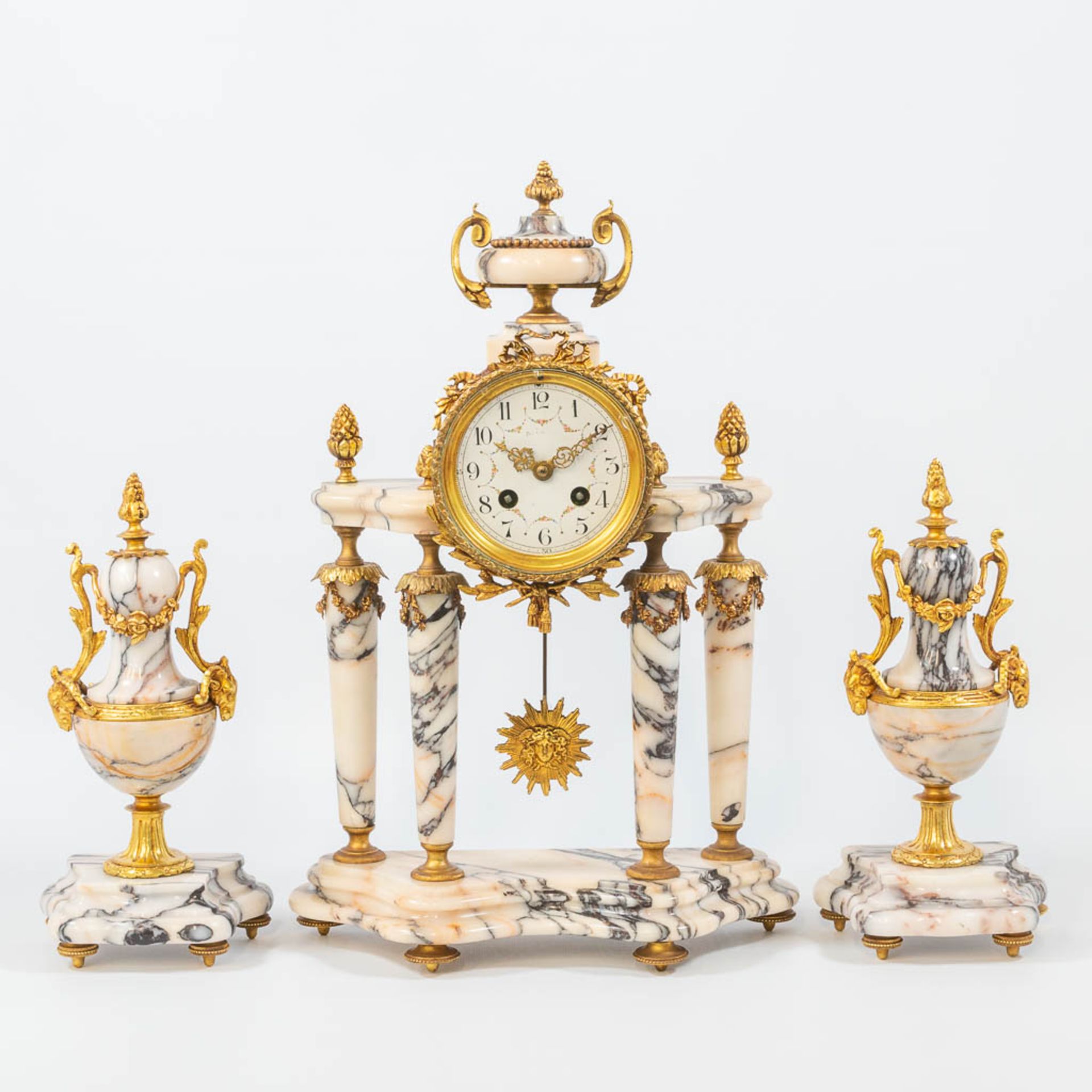 A louis XVI style 3-piece garniture clock with bronze mounted marble column clock, and 2 side pieces