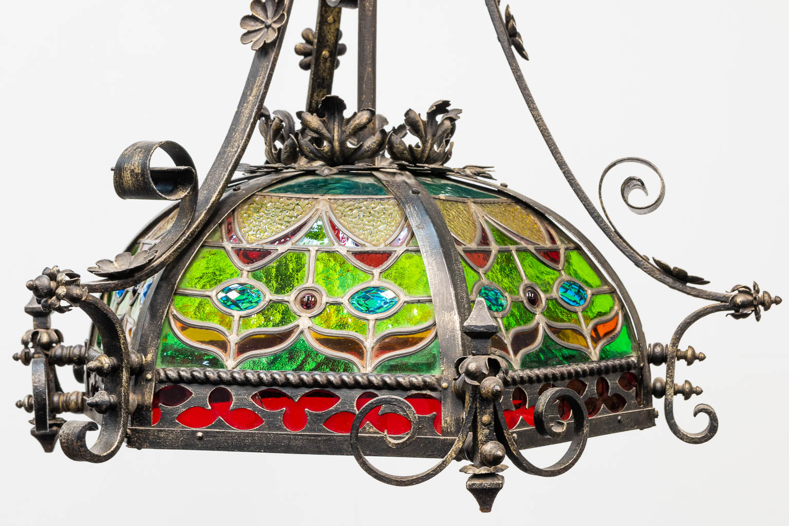 A wrought iron and stained lead glass chandelier. - Image 7 of 12