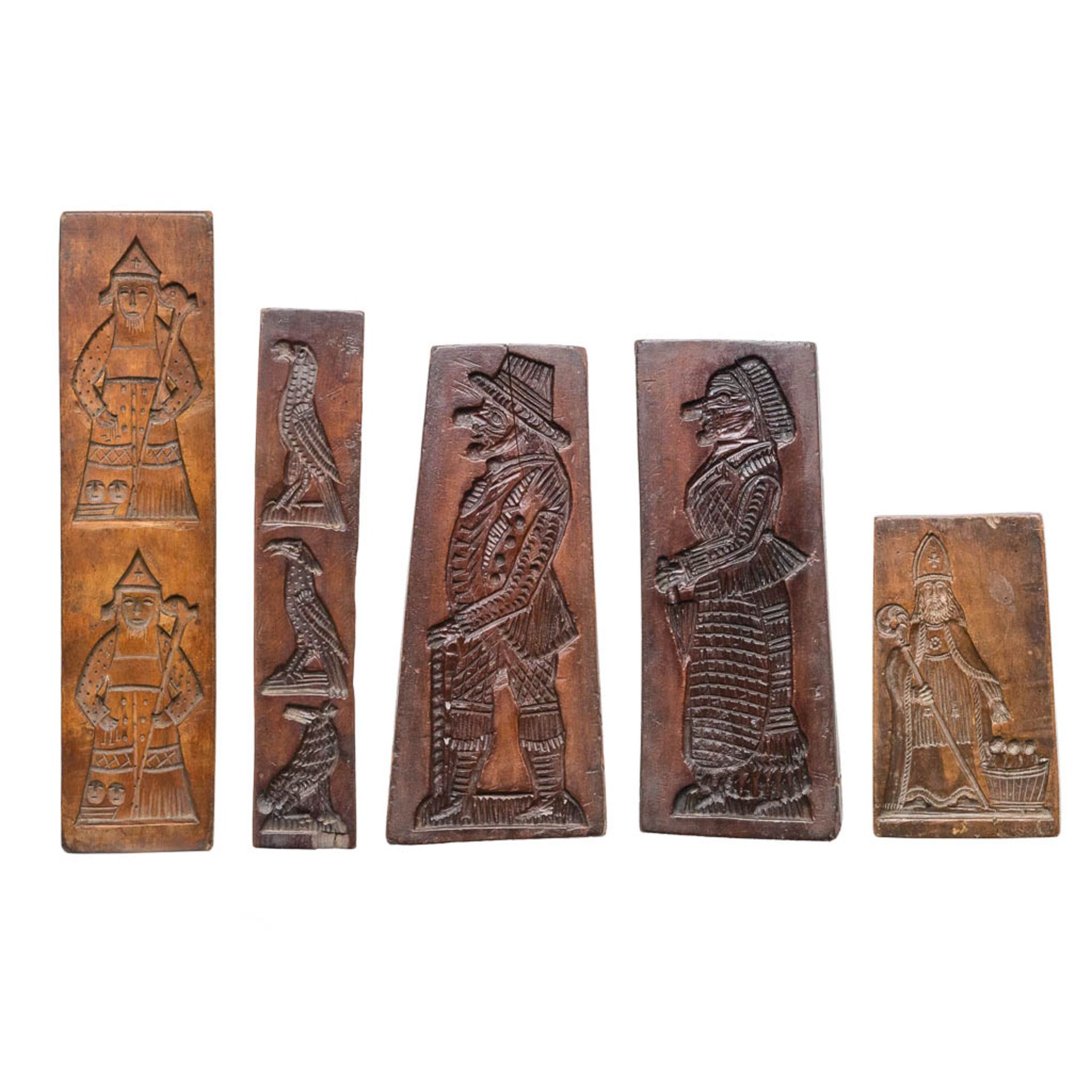 A collection of 5 wood cookies or gingerbread moulds/molds.