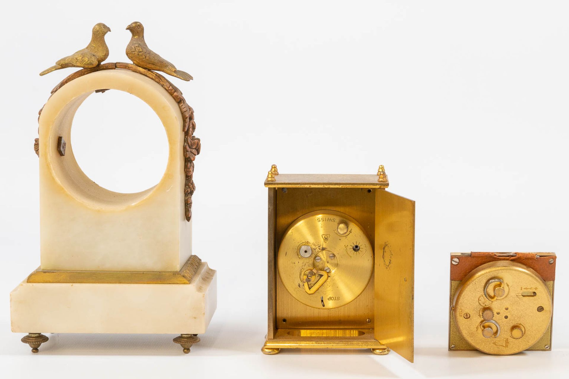 A collection of clocks and parts, a comptoise, an officers clock and table clock marked 'Jaeger Le C - Bild 22 aus 22